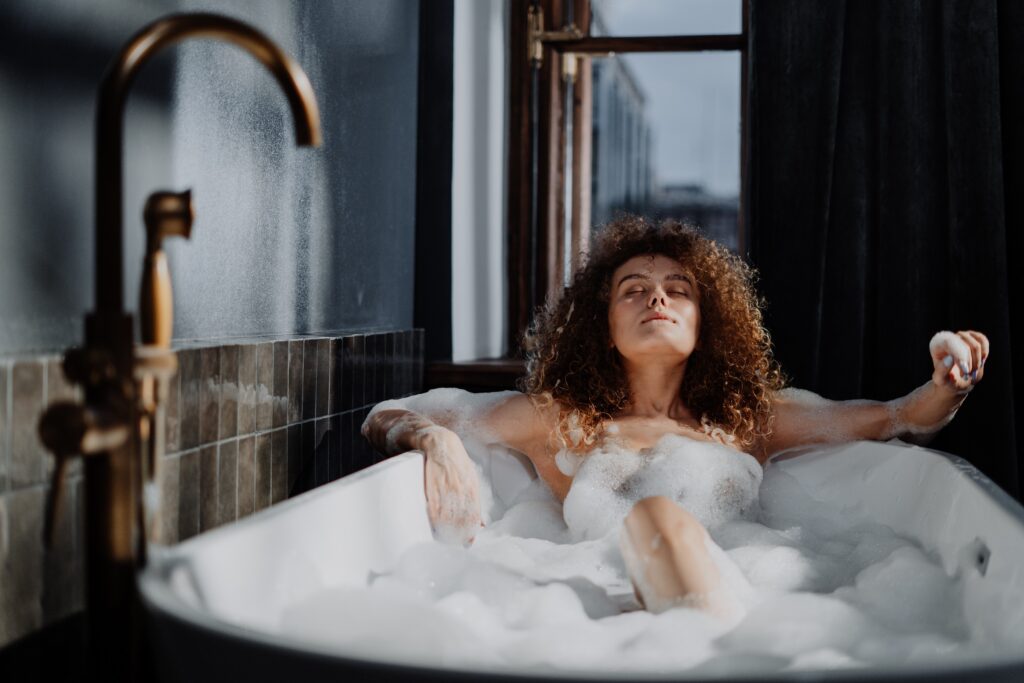 woman in a bubble bath, castile soap uses